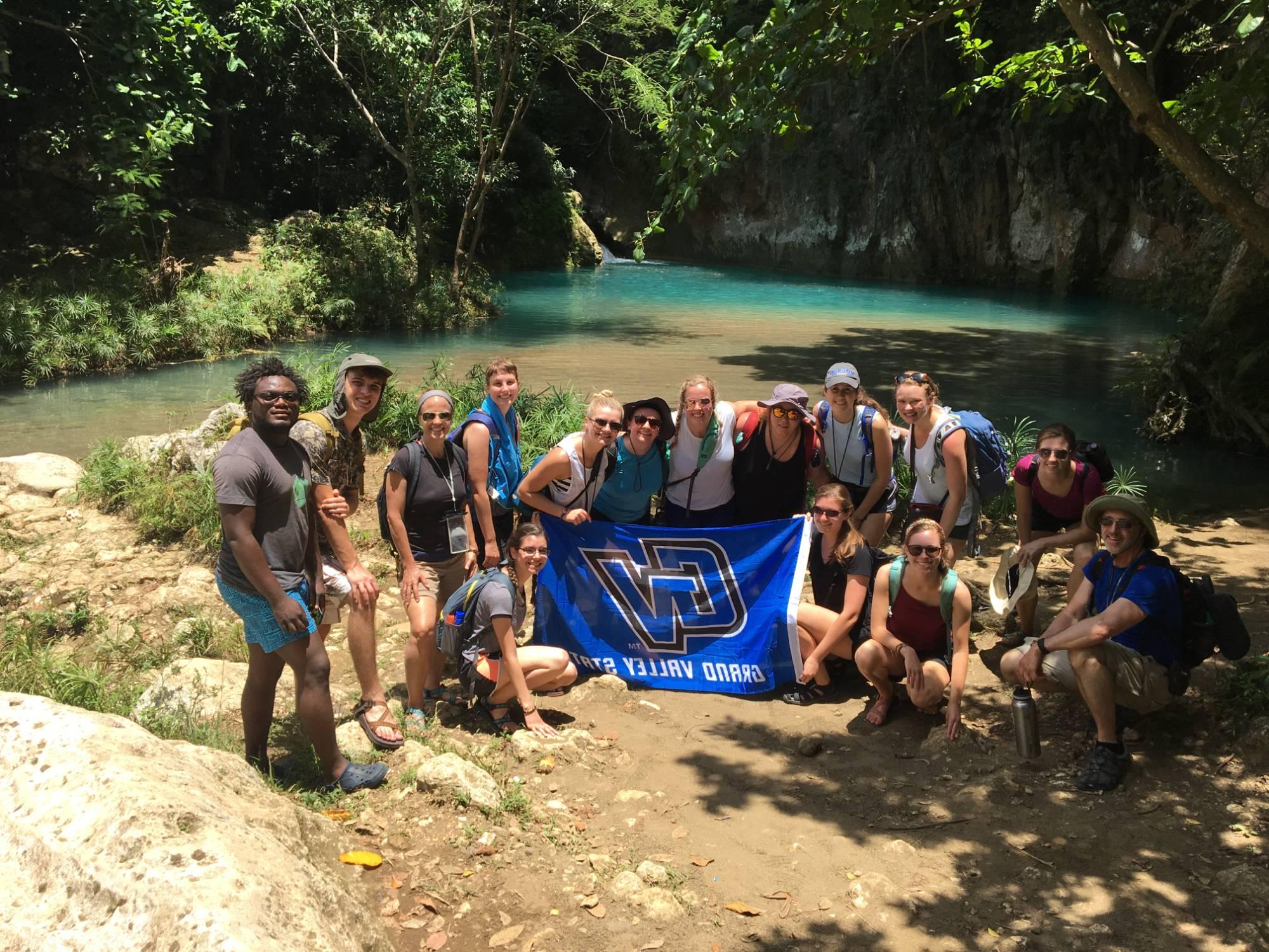 Honors students in Haiti with a GVSU flag